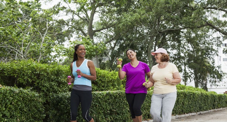 0281_450309317 three women walking through a park