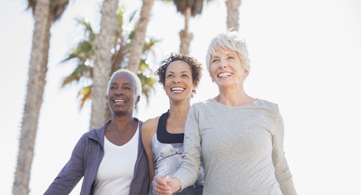 three women walking outside